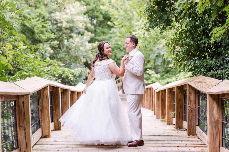 Katie And Jacob Cam North Photography Bride And Groom On Bridge Looking Back