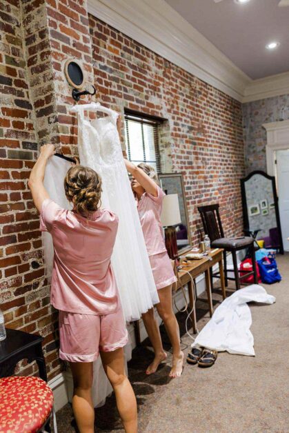 Katie And Jacob Cam North Photography Bridesmaids Preparing The Dress