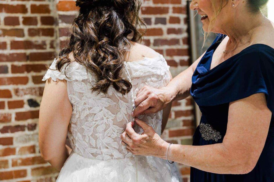 Katie And Jacob Cam North Photography Mother Helping Bride With Dress